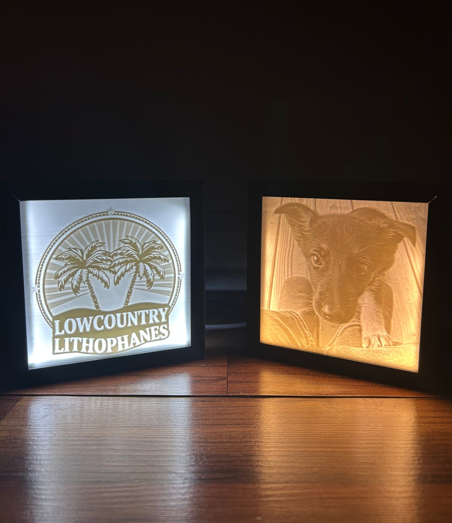 Two decorative signs with engraved designs on a wooden surface.