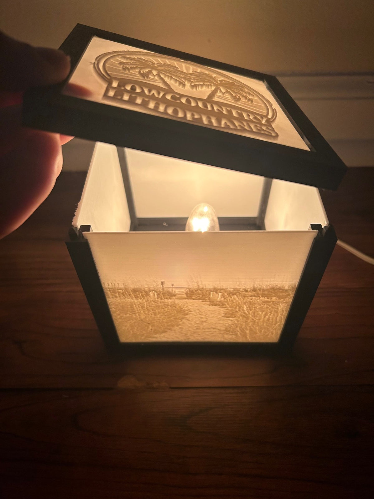 Open lithophane box with a customized Lowcountry Lithophanes logo top panel