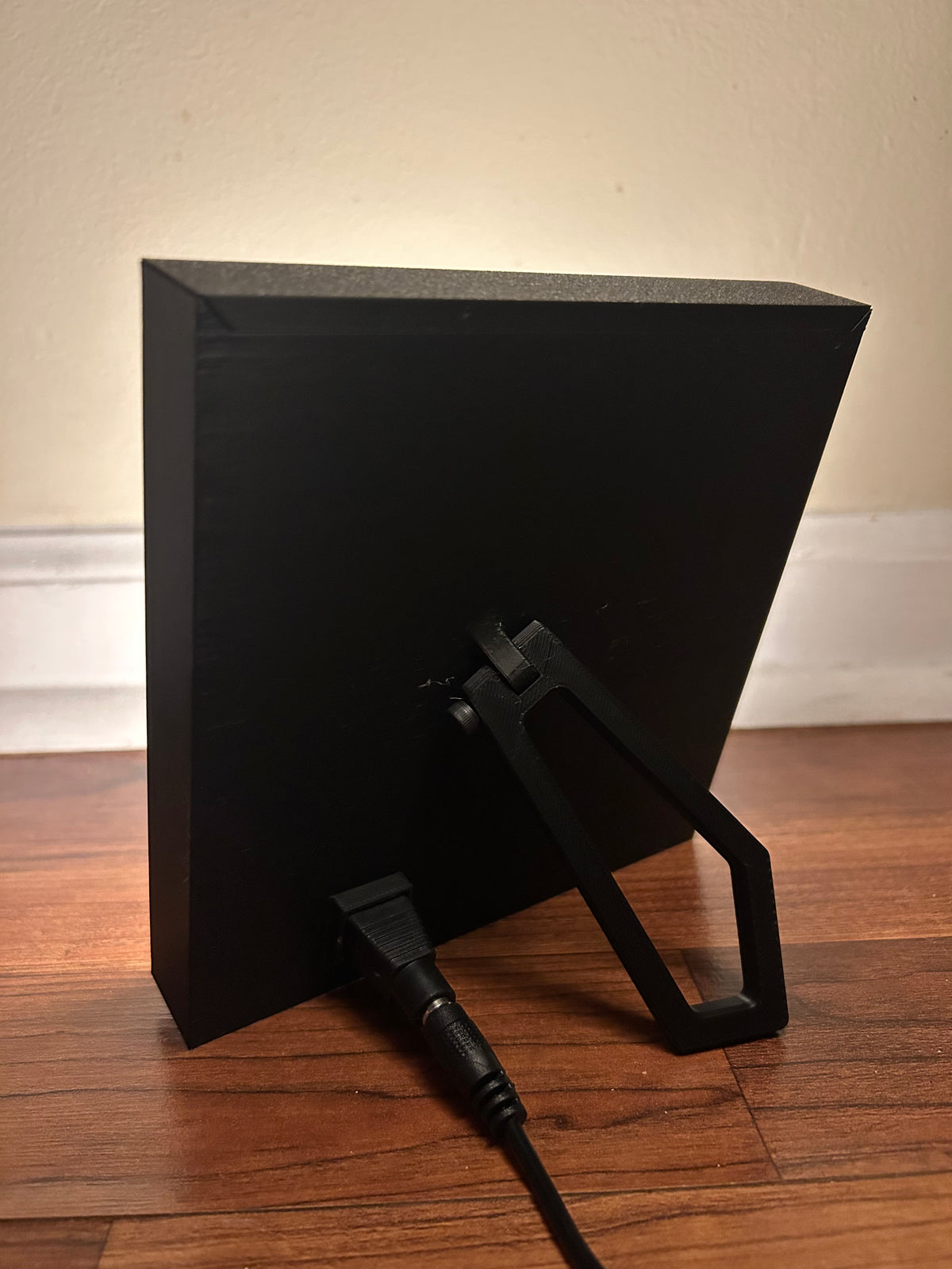 Back of the lithophane picture frame showing the kickstand and power cord